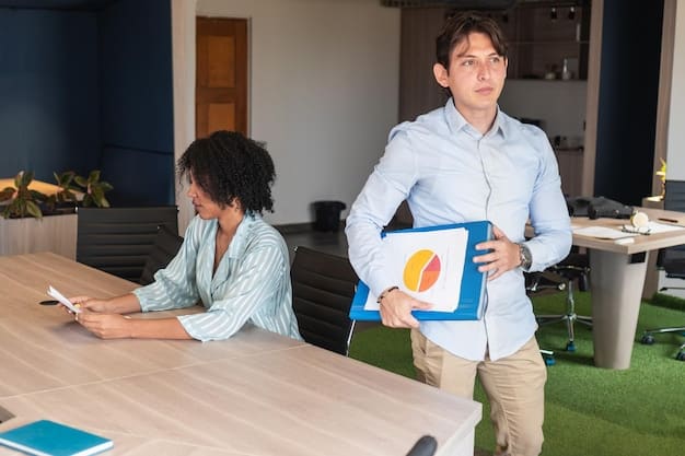 A manager administering a learning styles assessment questionnaire to an employee in a quiet office setting.