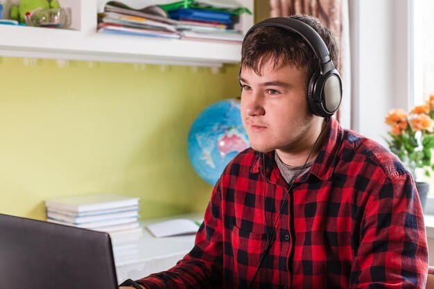 A student wearing headphones is attentively listening to an online lecture on their laptop, with a notebook nearby for taking notes. The setting is a quiet study area, emphasizing concentration and the importance of auditory learning strategies.