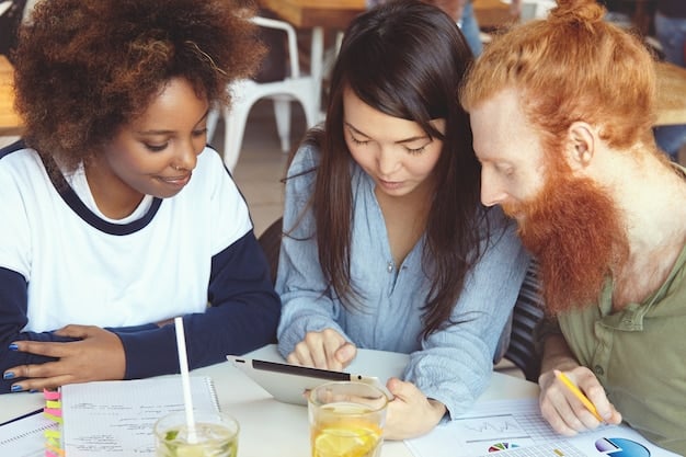 Three students collaborating on a project, with one explaining their thought process while the others listen intently and take notes.