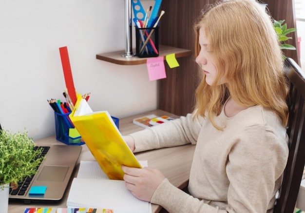A student sitting at a desk, surrounded by color-coded notes, diagrams, and digital flashcards on a laptop, illustrating a personalized study setup.